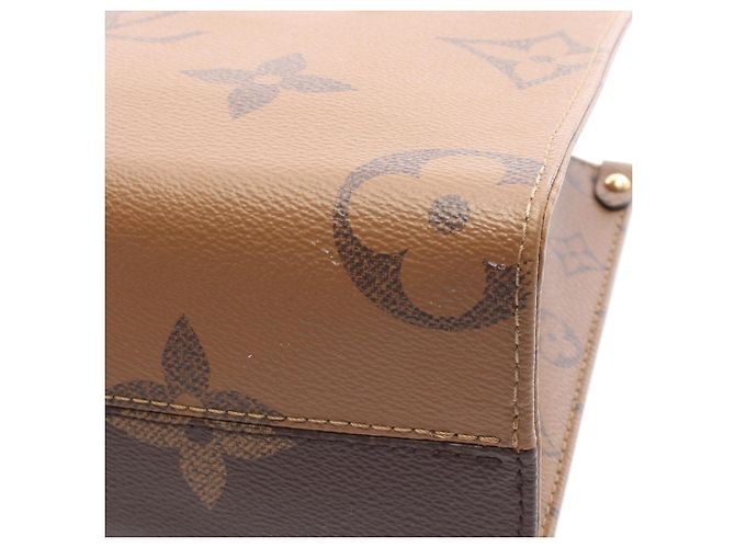 Louis Vuitton Marrone Monogram Reverse Giant OnTheGo PM - vista 5