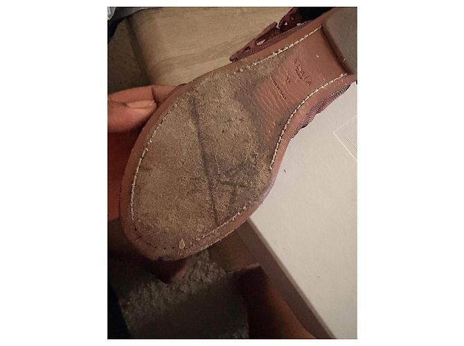 Sandali Alaïa in pelle rossa traforati con piume Nero Rosso - vista 9