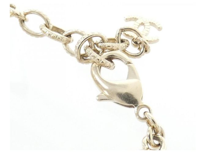 Pulsera Charm Chanel Negro Blanco Dorado - vista 5