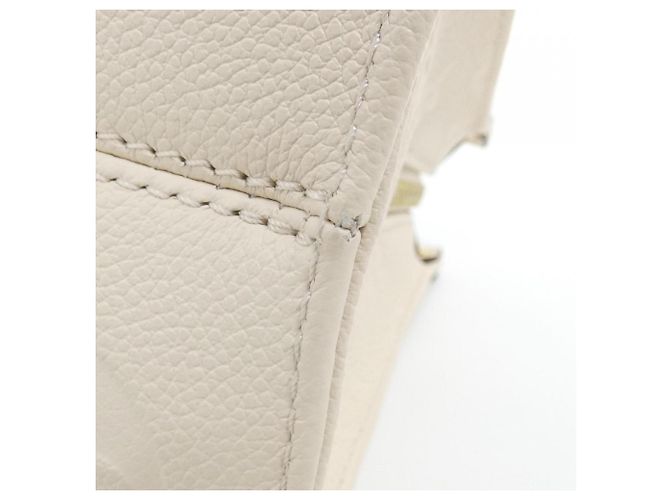 Bolso Louis Vuitton Monogram Empreinte OnTheGo EW Beige - vista 2
