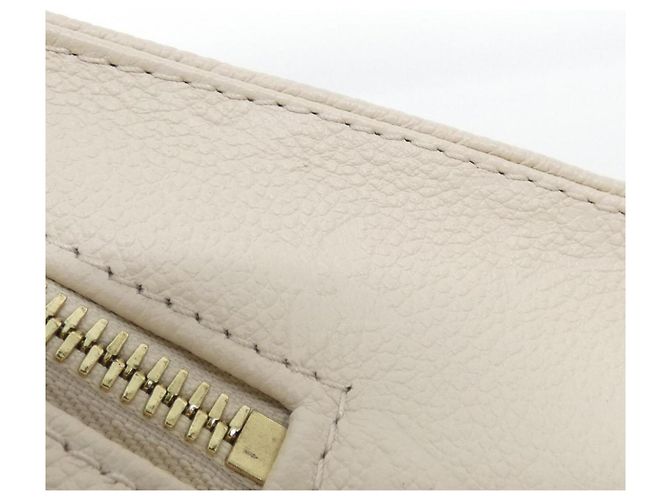 Bolso Louis Vuitton Monogram Empreinte OnTheGo EW Beige - vista 3