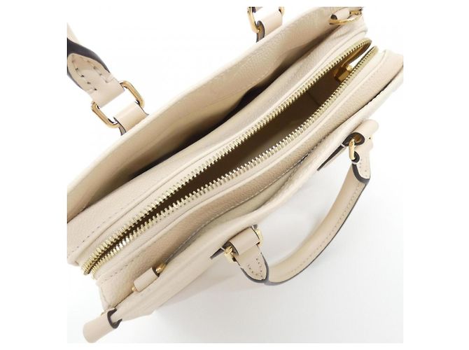 Bolso Louis Vuitton Monogram Empreinte OnTheGo EW Beige - vista 6