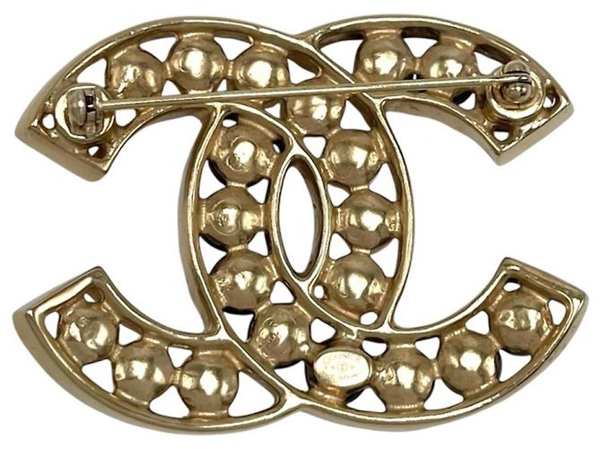 Broche de mujer Chanel en negro, dorado y blanco - vista 2