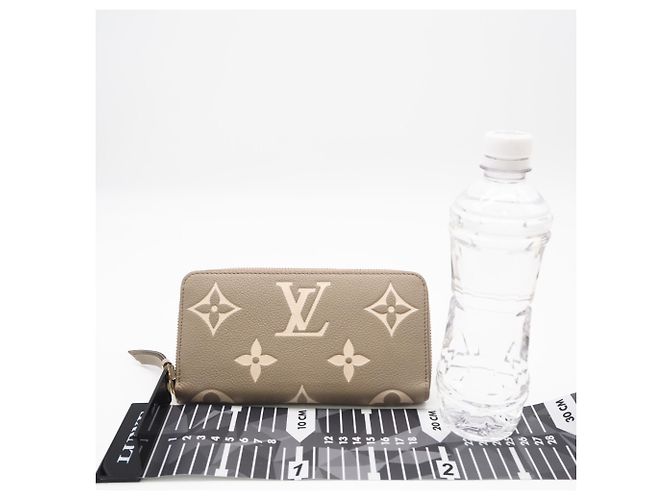 Louis Vuitton Monogram Empreinte Bicolor Zippy Wallet Beige - vista 3