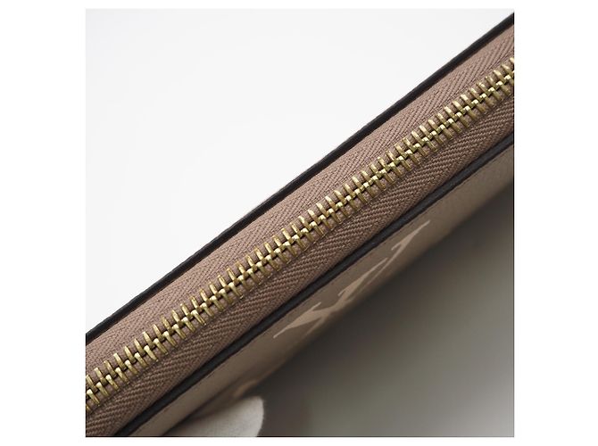 Louis Vuitton Monogram Empreinte Bicolor Zippy Wallet Beige - vista 9