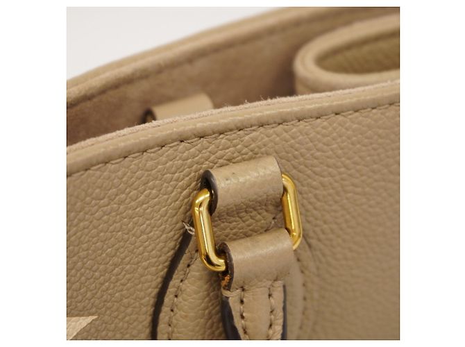 Borsa Tote Louis Vuitton Monogram Empreinte Bicolor OnTheGo MM Grigio Crudo - vista 10
