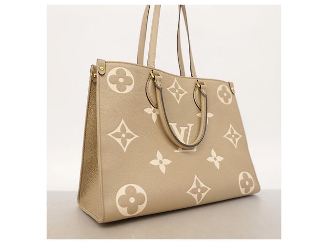 Borsa Tote Louis Vuitton Monogram Empreinte Bicolor OnTheGo MM Grigio Crudo - vista 2