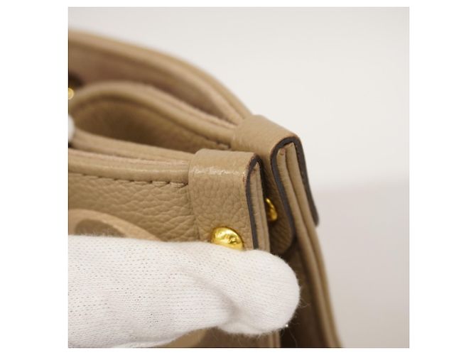 Borsa Tote Louis Vuitton Monogram Empreinte Bicolor OnTheGo MM Grigio Crudo - vista 9