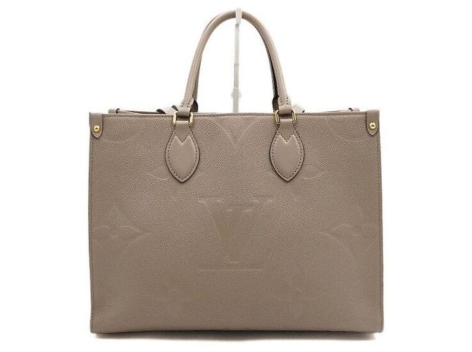 Louis Vuitton Bolso Tote Monogram Empreinte OnTheGo MM Castaño - vista 4