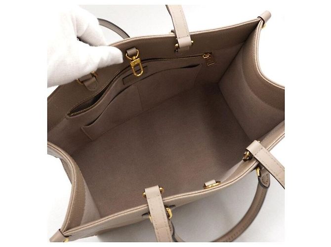 Louis Vuitton Bolso Tote Monogram Empreinte OnTheGo MM Castaño - vista 5