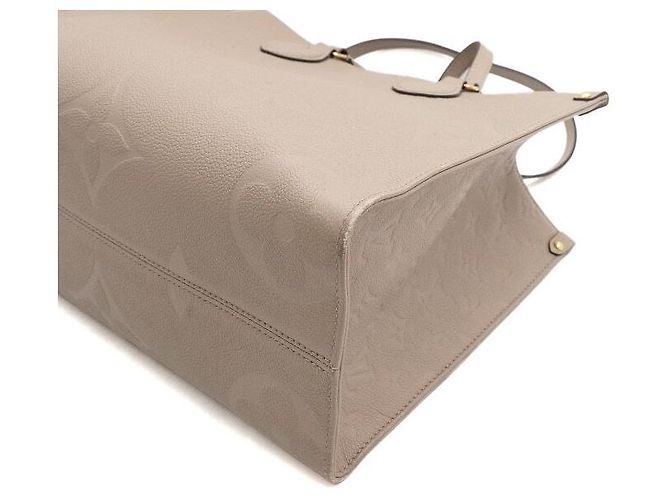 Louis Vuitton Bolso Tote Monogram Empreinte OnTheGo MM Castaño - vista 7