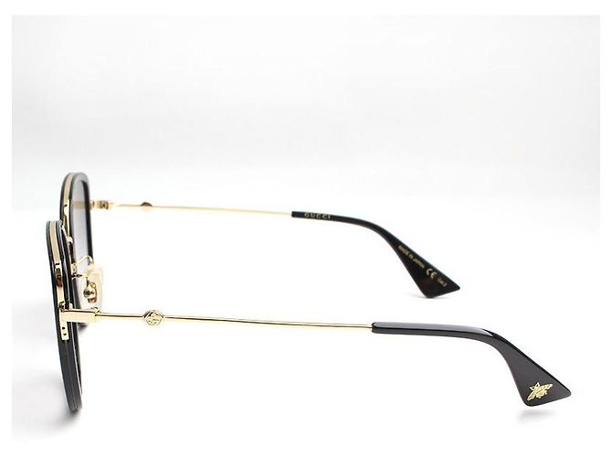 Gucci Schwarze Sonnenbrille mit flachem Goldton-Gestell - Ansicht 3