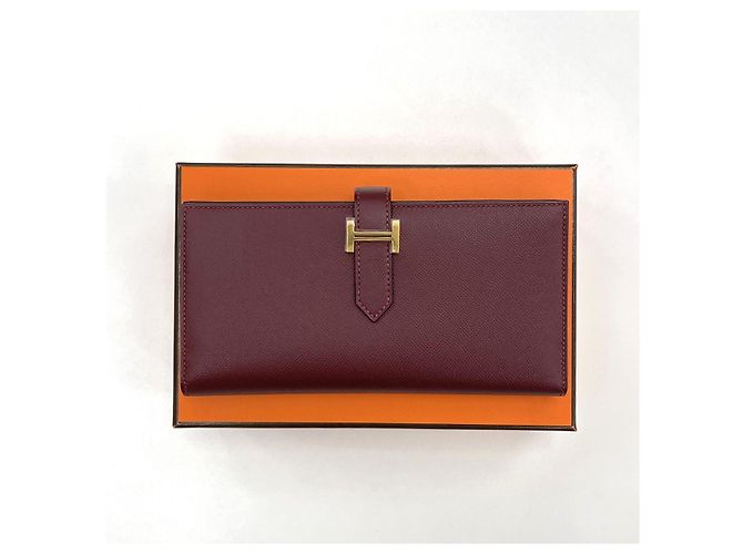Hermès Lange Brieftasche Beige mit Goldprägung - Geschenk Rot - Ansicht 2