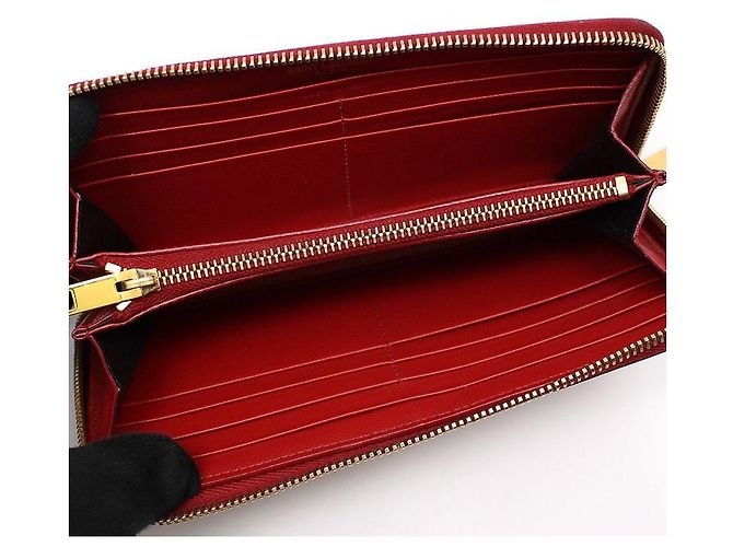 Saint Laurent Portafoglio lungo con zip in caviar rosso e monogramma dorato - vista 7