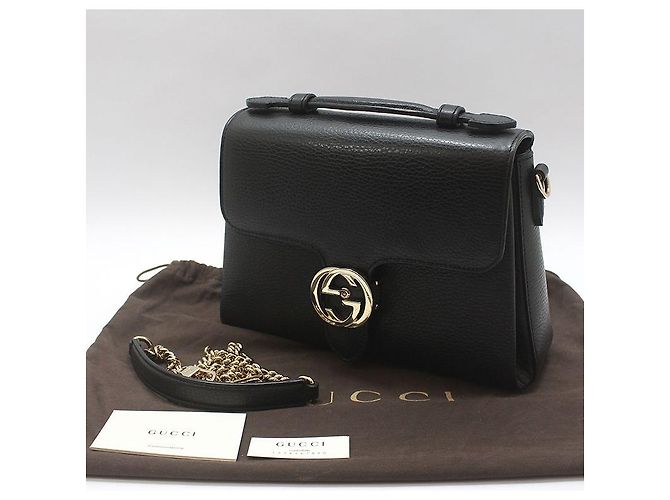 Gucci Bolsa de mão e de ombro com corrente e alça superior entrelazada em couro preto - vista 2