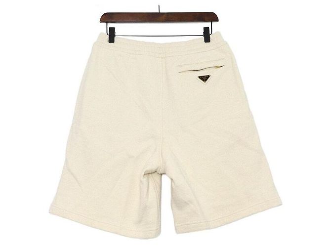 Prada Pantaloncini Bermuda in cotone avorio con logo dorato da uomo Bianco - vista 4