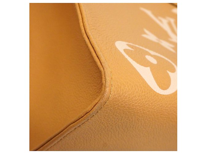 Borsa Tote Louis Vuitton Monogram Empreinte Bicolor OnTheGo MM Crudo - vista 6
