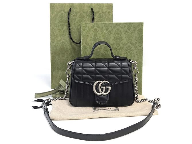 Gucci Mini borsa a tracolla con patta in pelle matelassé GG Marmont nera Nero - vista 10