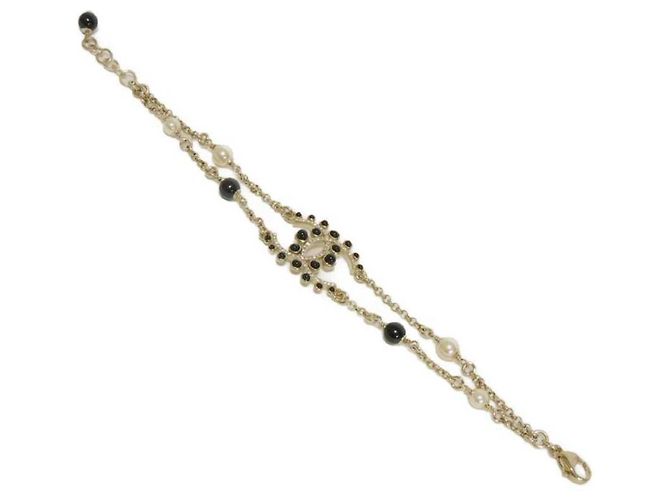 Pulsera Charm Chanel Negro Dorado Crudo - vista 2