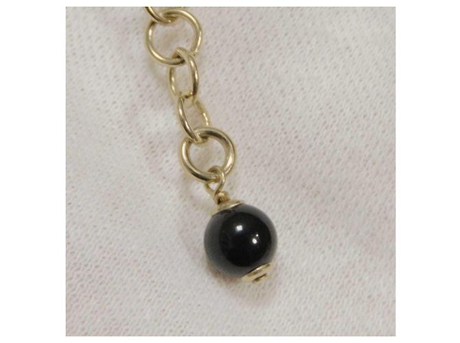 Pulsera Charm Chanel Negro Dorado Crudo - vista 6
