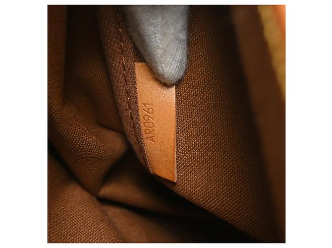Louis Vuitton Saumur Monogram Canvas 35 Marrone - vista 5