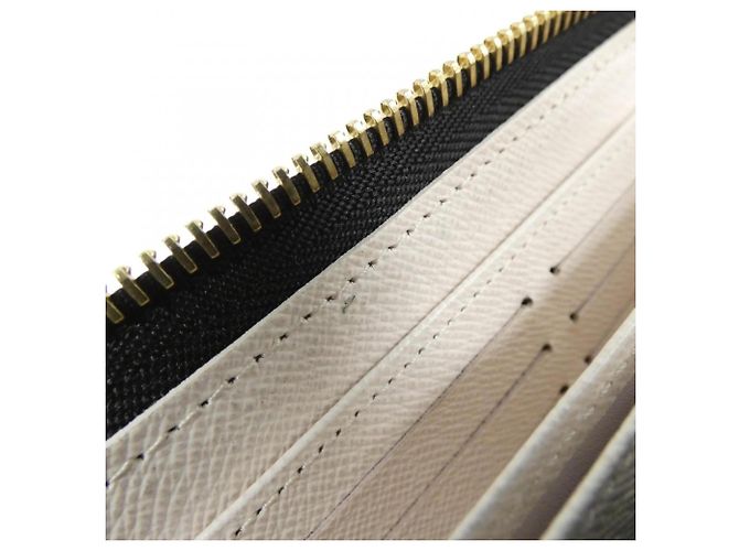 Cartera Louis Vuitton LV Crafty Zippy Crudo Caramelo - vista 8