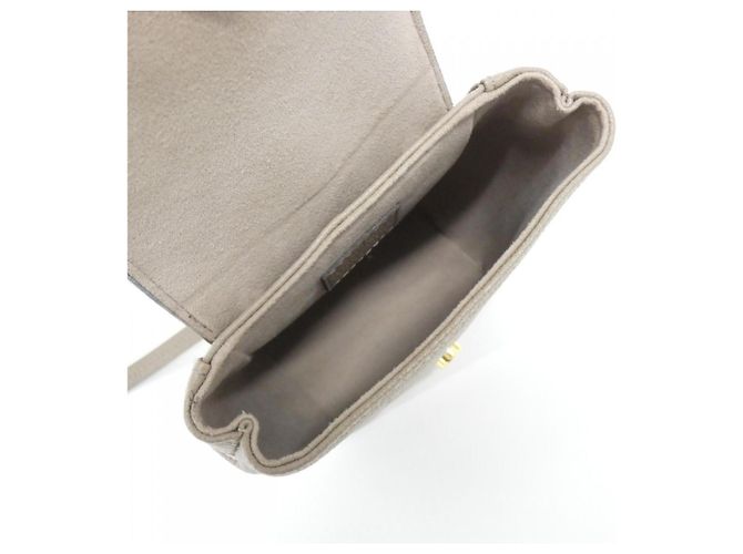 Zainetto Louis Vuitton Bicolor Monogram Empreinte Tiny Backpack Grigio Crudo - vista 9