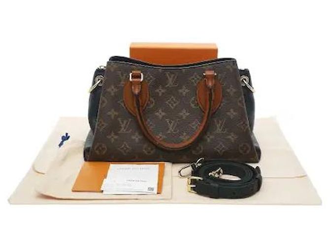 Louis Vuitton A timepiece bag harmonizing a classic Monogram pattern with a luxurious handle. Despite its compact BB size, it has ample interior storage for efficiently keeping daily belongings. Sturdy canvas Brown - view 10
