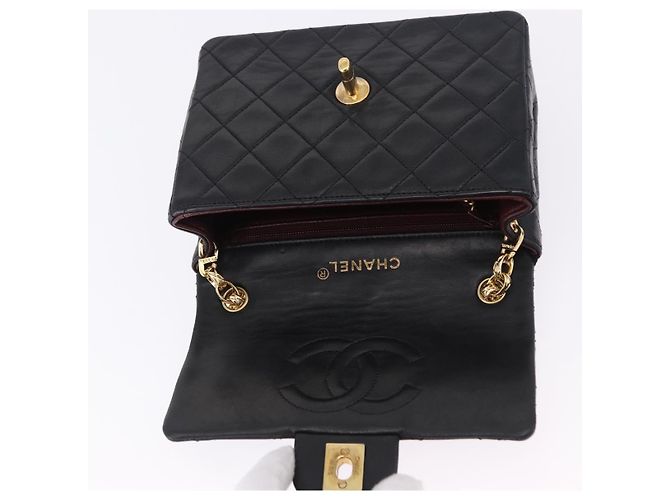 Borsa a tracolla CHANEL Chain Mini Matelasse in pelle d'agnello nera e oro CC Auth 195391SAV Nero D'oro - vista 16