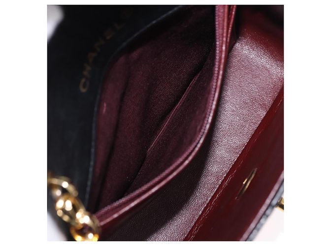 Borsa a tracolla CHANEL Chain Mini Matelasse in pelle d'agnello nera e oro CC Auth 195391SAV Nero D'oro - vista 25