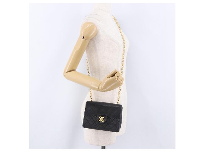 Borsa a tracolla CHANEL Chain Mini Matelasse in pelle d'agnello nera e oro CC Auth 195391SAV Nero D'oro - vista 28