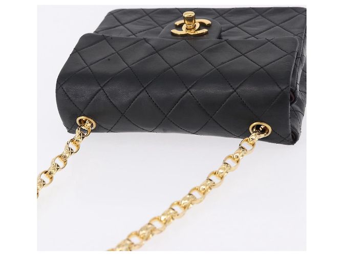 Borsa a tracolla CHANEL Chain Mini Matelasse in pelle d'agnello nera e oro CC Auth 195391SAV Nero D'oro - vista 7