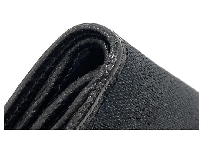 Portafoglio bi-fold Gucci in canvas GG nero - vista 17