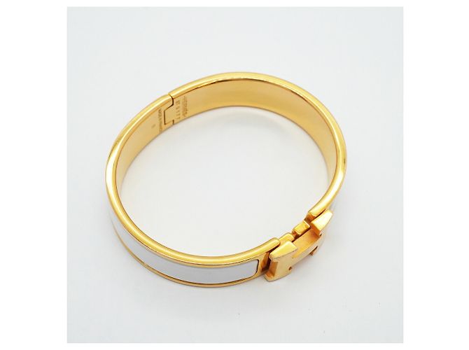 Brazalete Hermès Clic Clac PM Oro y Blanco Dorado - vista 2