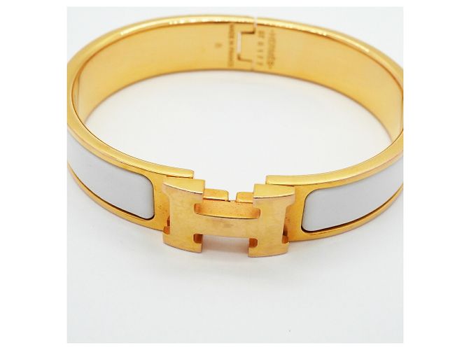 Brazalete Hermès Clic Clac PM Oro y Blanco Dorado - vista 4