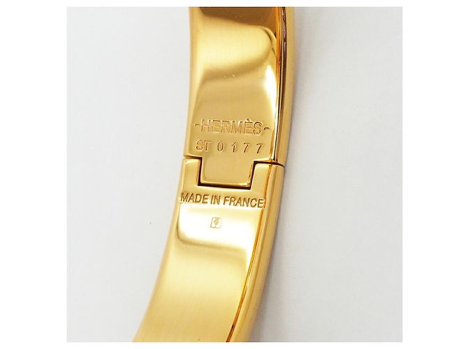 Brazalete Hermès Clic Clac PM Oro y Blanco Dorado - vista 5