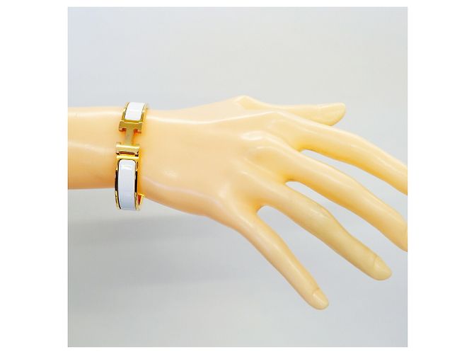 Brazalete Hermès Clic Clac PM Oro y Blanco Dorado - vista 6