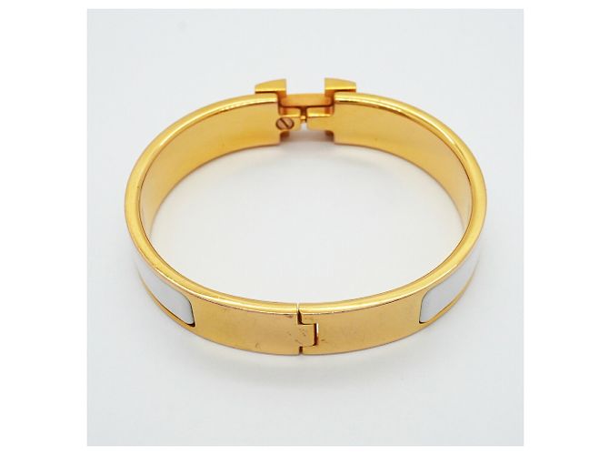 Brazalete Hermès Clic Clac PM Oro y Blanco Dorado - vista 7