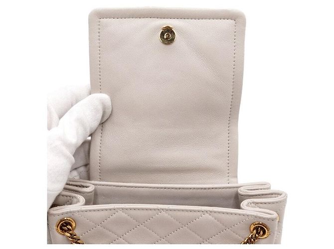 Saint Laurent Borsa a tracolla e spalla Nolita in pelle d'agnello crema con monogramma dorato Bianco - vista 6