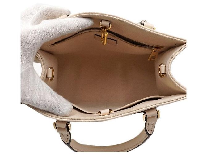 Louis Vuitton Borsa a mano e a tracolla OnTheGo PM Monogram Empreinte Cream Marrone - vista 6