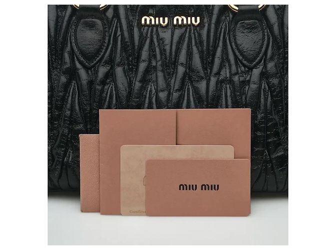Made using Miu Miu's iconic, sophisticated Matelasse technique, this delivers both a three-dimensional texture and an elegant atmosphere. The soft leather material develops natural charm with use, Black - view 10