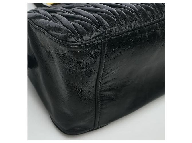 Made using Miu Miu's iconic, sophisticated Matelasse technique, this delivers both a three-dimensional texture and an elegant atmosphere. The soft leather material develops natural charm with use, Black - view 6