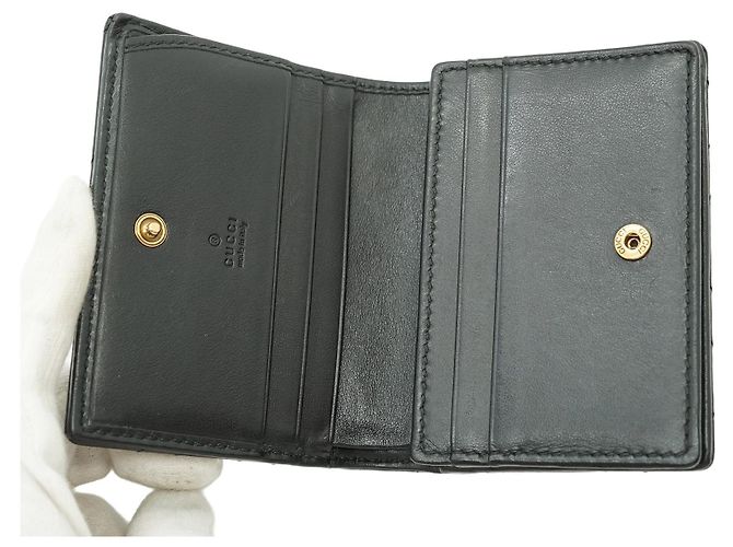 Gucci Cartera compacta y monedero GG Marmont de piel acolchada negra Negro - vista 6