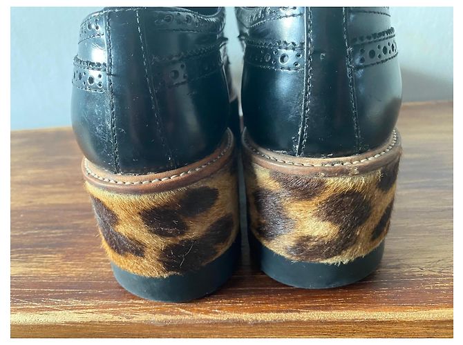 Prada Scarpe Richelieu con plateau in pelle nera e stampa leopardata Nero Stampa leopardo - vista 12