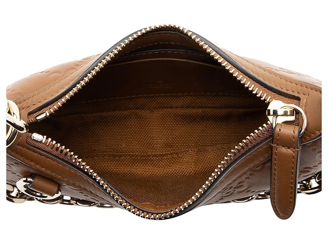 Mini borsa a tracolla in pelle con emblema GG in rilievo Gucci Marrone - vista 7