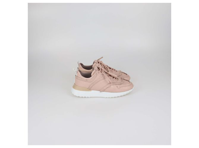 Sneakers basse Tod's in pelle traforata rosa con frange e nappe - vista 3