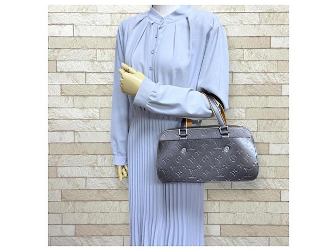Borsa Louis Vuitton Shelton Monogram Mat Marrone Nero - vista 2