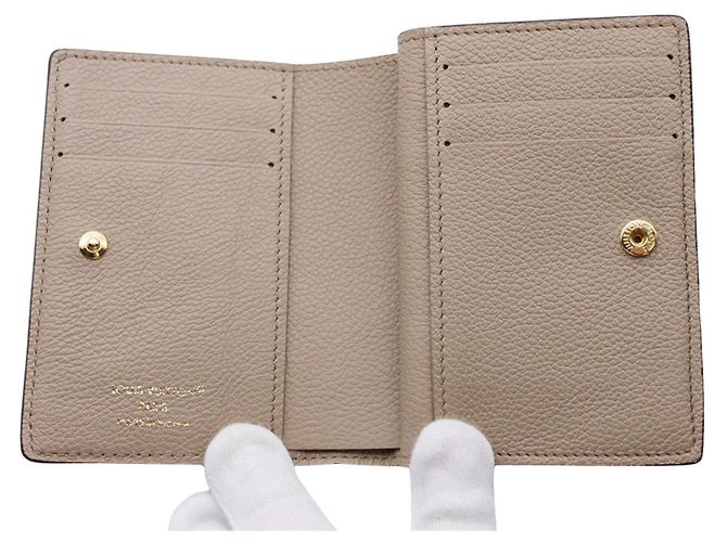 Cartera Louis Vuitton Bi-fold Monogram Empreinte Negro Beige - vista 7