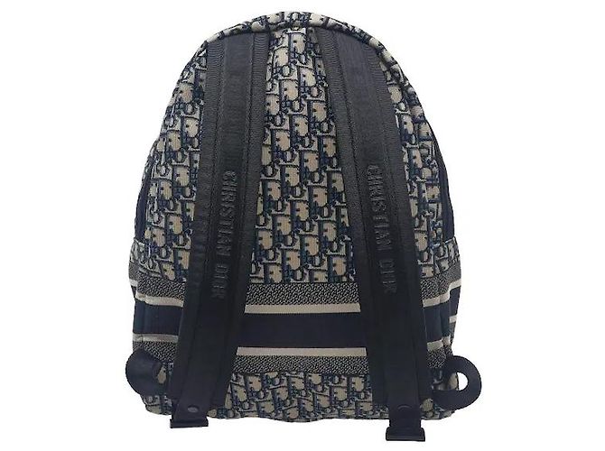 Christian Dior A travel backpack featuring Dior's iconic Oblique jacquard pattern. Made from waterproof technical canvas material, it offers a lighter weight than leather along with scratch-resistant durability. A - view 2