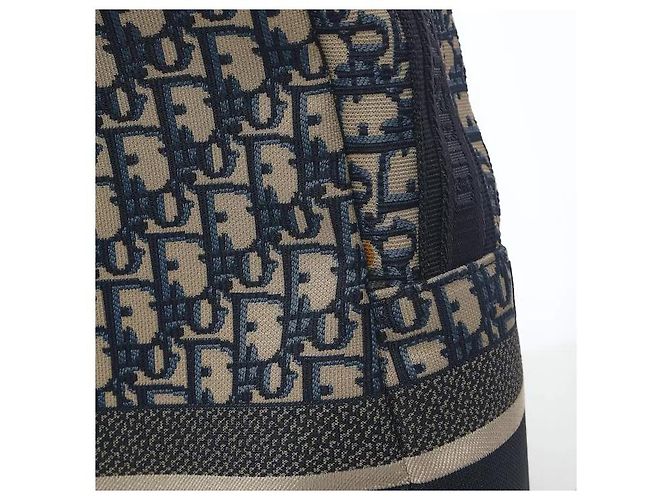 Christian Dior A travel backpack featuring Dior's iconic Oblique jacquard pattern. Made from waterproof technical canvas material, it offers a lighter weight than leather along with scratch-resistant durability. A - view 4